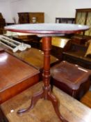 AN ANTIQUE MAHOGANY CIRCULAR TILT TOP TRIPOD TABLE