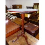 AN ANTIQUE MAHOGANY CIRCULAR TILT TOP TRIPOD TABLE