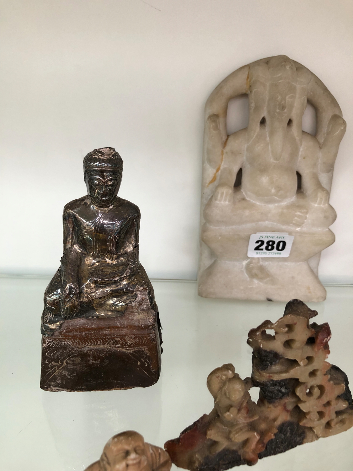 A BUDDISTIC SILVER WRAPPED SEATED DEITY, A CARVED MARBLE EXAMPLE, TWO SOAP STONE CARVINGS, AND AN - Image 3 of 3