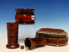 A LIGNUM VITAE CYLINDRICAL BOWL. Dia. 10.5cms. TWO TREEN DICE SHAKERS TOGETHER WITH AN INDIAN CARVED