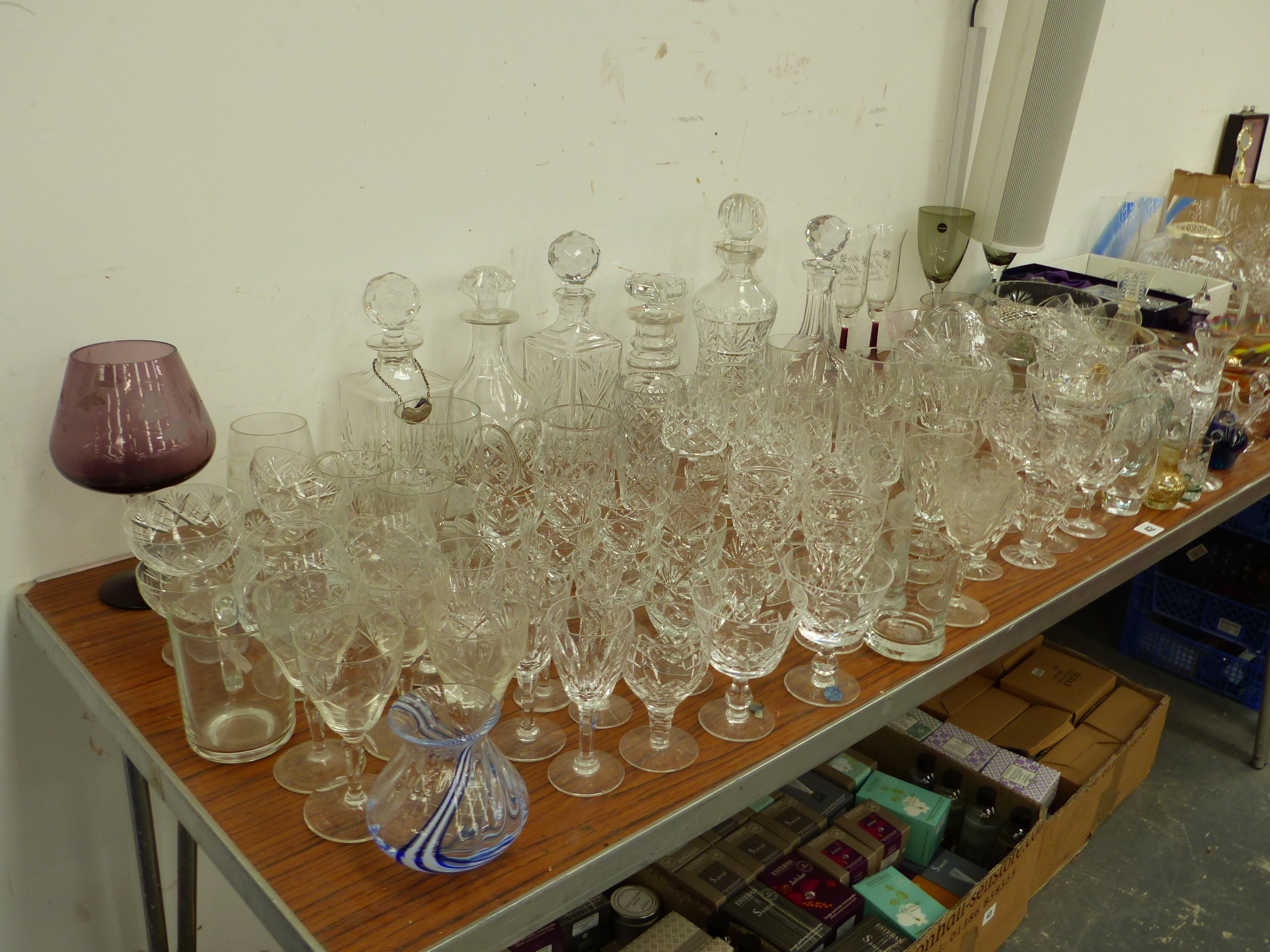 AN EXTENSIVE COLLECTION OF CUT GLASSWARES, TO INCLUDE DECANTERS, BOWLS, VASES ETC.