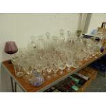 AN EXTENSIVE COLLECTION OF CUT GLASSWARES, TO INCLUDE DECANTERS, BOWLS, VASES ETC.