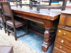 A MAHOGANY REFECTORY TABLE SUPPORTED ON BALUSTER LEGS WITH BUN FEET. W 202 x D 91 x H 77cms.