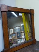 A 19TH CENTURY RECTANGULAR MIRROR IN AN ARTS AND CRAFTS FRAME INLAID WITH FRUITING VINES AND WITH SQ