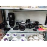 PENTAX, AND EXAKTA CAMERAS AND VARIOUS CAMERA LENSES AND MANUALS.