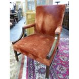 AN ANTIQUE 19TH CENTURY MAHOGANY GAINSBOROUGH CHAIR UPHOLSTERED IN RUST COLOURED VELVET