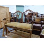 AN ANTIQUE MAHOGANY CHIPPENDALE STYLE TWIN BACKED CHAIR, THE HANDLES OF THE ARMS FOLIATE CARVED, THE