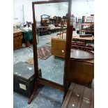 A MAHOGANY FRAMED FULL LENGTH RECTANGULAR MIRROR, THE SUPPORTS AND LEGS REEDED, THE PLATE. 113 x