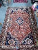 AN ANTIQUE PERSIAN SHIRAZ RUG 247 x 154cm