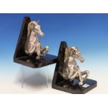 A PAIR OF OTTAVIANI SILVER PRANCING HORSE BOOKENDS, THEIR HALF BODIES BACKED BY BLACK TRIANGLES