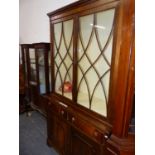 A GEORGIAN STYLE MAHOGANY TWO PART BOOK CASE. W 155 X D 43 X H 207CMS.