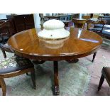 A MAHOAGANY VICTORIAN CIRCULAR BREAKFAST TABLE SUPPORTED ON TURNED COLUMN AND TRIPOD ENDING IN LEAF
