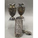 A PAIR OF WHITE METAL ASSESSED AS SILVER PIERCED AND FLARED JARS, TOGETHER WITH A CONTINENTAL SILVER