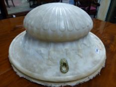 AN ALABASTER CEILING DISH WITH THREE ORMOLU SUSPENSION RINGS IN A FRIEZE OF DANCING CLASSICAL