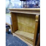 A PINE OPEN BOOKCASE WITH TWO SHELVES ADJUSTABLE BELOW THE DENTIL CORNICE. W 108 x D 31 x H 118cms.