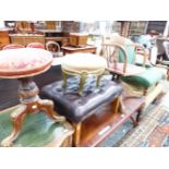 A VICTORIAN MAHOGANY PIANO STOOL, THE CIRCULAT NEEDLE WORKED SEAT ADJUSTABLE ON THE FOLIATE CARVED