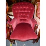 A VICTORIAN MAHOGANY ARMCHAIR WITH THE HOOP BACK BUTTONED IN DEEP PINK VELVET, THE SERPENTINE FRONT