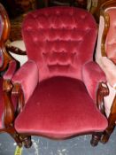 A VICTORIAN MAHOGANY ARMCHAIR WITH THE HOOP BACK BUTTONED IN DEEP PINK VELVET, THE SERPENTINE FRONT