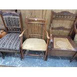 A CANE SEATED COMMODE ELBOW CHAIR WITH WHITE CERAMIC FITTINGS, ANOTHER ELBOW CHAIR AND A MAHOGANY