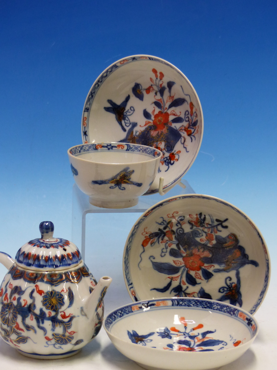 A CHINESE IMARI LOBED TEA POT AND COVER PAINTED WITH FLOWERS TOGETHER WITH A TEA BOWL AND THREE