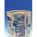 A CHINESE BLUE AND WHITE HEXAGONAL PLANTER PAINTED AND INSCRIBED WITH ISLAND SCENES. H 25cms.
