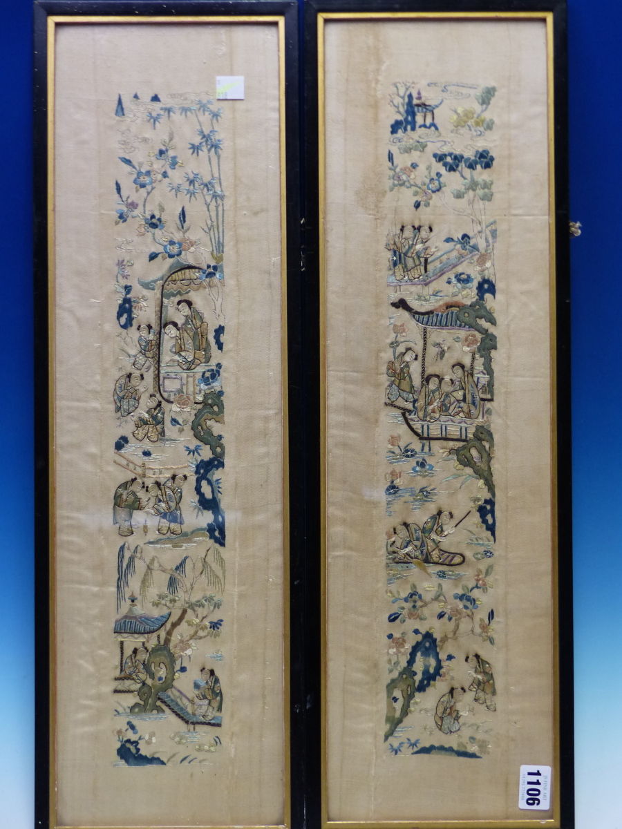 A PAIR OF CHINESE CREAM SILK SLEEVE PANELS EMBROIDERED WITH LADIES AND CHILDREN IN AND ABOUT