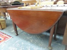 A GEORDIAN MAHOGANY OVAL DROP FLAP TABLE WITH EGG AND DART CARVED EDGE, TAPERING CYLINDRICAL LEGS WI