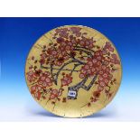 A JAPANESE GOLD GROUND DISH PAINTED WITH FLOWERING CHERRY, A TWO CHARACTER MARK (KIZAN?) BY THE