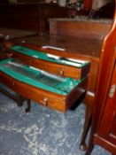 A MAHOGANY CUTLERY TABLE CONTAINING APPROXIMATELY TWELVE PLACE SETTINGS OF ELECTROPLATE CUTLERY