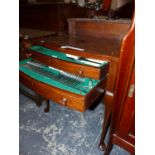 A MAHOGANY CUTLERY TABLE CONTAINING APPROXIMATELY TWELVE PLACE SETTINGS OF ELECTROPLATE CUTLERY