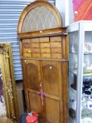 AN UNUSUAL HOME MADE UTILITY CORNER CABINET WITH MULTI DRAWER UPPER SECTION.