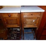 A PAIR OF FRENCH WHITE MARBLE TOPPED OAK BEDSIDE CUPBOARDS ON REEDED TAPERING CYLINDRICAL LEGS, EACH