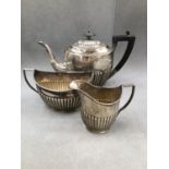 A HALLMARKED SILVER THREE PIECE TEA SET DATED 1913 LONDON FOR WILLIAM HUTTON. GROSS WEIGTH 864grms.