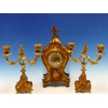 A FRENCH CLOCK GARNITURE, THE BALLOON SHAPED GOLD GROUND CLOCK WITH ENAMELLED NUMERALS SET IN A GILT