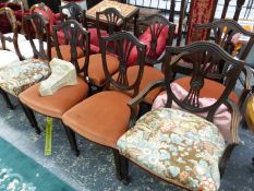 A SET OF EIGHT MAHOGANY SHIELD BACK DINING CHAIRS INCLUDING TWO WITH ARMS, THE FOUR BAR BACKS