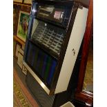 A SEEBURG JUKE BOX TO PLAY A SELECTION OF FORTY EIGHT DISCS WITH THEIR TITLES BEHIND GLASS ABOVE A