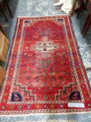 A PERSIAN TRIBAL RUG 202 x 133 cm TOGETHER WITH A TIBETAN RUG 182 x 96cm (2)