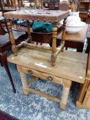 A LEATHER STRAP WORK SEATED OAK STOOL TOGETHER WITH A SINGLE DRAWER PINE TABLE ON RING TURNED