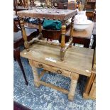 A LEATHER STRAP WORK SEATED OAK STOOL TOGETHER WITH A SINGLE DRAWER PINE TABLE ON RING TURNED