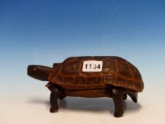 A HINGED TORTOISESHELL LINED WITH A WOOD CARVING OF THE ANIMAL AS A BOX WITH LIFT OFF LID AND