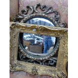 A CONVEX MIRROR IN OPOEN WORK GILT SCROLL FRAME. Dia. 57cms. TOGETHER WITH A SMALLER RECTANGULAR