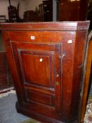 AN 18TH C. COUNTRY OAK PANEL DOOR CORNER CABINET. W 78 X D 40 X H 104CMS.