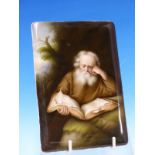 A GERMAN PORCELAIN PLAQUE, POSSIBLY KPM, PAINTED WITH ST JEROME STUDYING A HOLY BOOK BELOW A TREE.