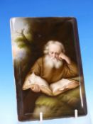 A GERMAN PORCELAIN PLAQUE, POSSIBLY KPM, PAINTED WITH ST JEROME STUDYING A HOLY BOOK BELOW A TREE.