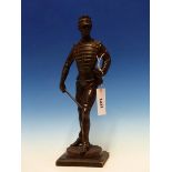A COPPER RICH BRONZE FIGURE OF AN EARLY 20TH CENTURY SOLDIER STANDING LOOKING OVER HIS LEFT