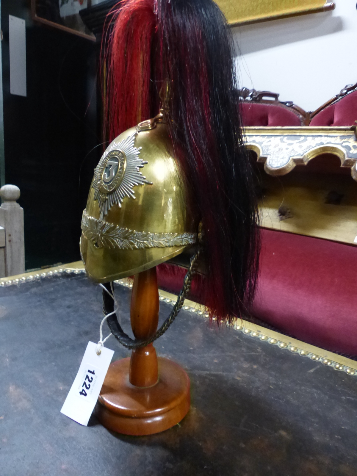 A 3RD DRAGOON GUARDS MINIATURE HELMET WITH BLACK AND RED HORSEHAIR PLUME.