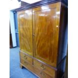 A GEORGE III MAHOGANY SMALL LINEN PRESS CONVERTED AS A WARDROBE. W 130 X D 66 X H 181CMS.