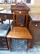 A VICTORIAN MAHOGANY HALL CHAIR, THE SWAN NECK TOP RAIL ABOVE A FLOWER STEM BACK PANEL, THE TAPERING