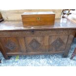 AN ANTIQUE OAK COFFER THE FRONT CARVED WITH ARCHES ABOVE THREE PANELS CARVED WITH DIAMOND FRAMES ENC