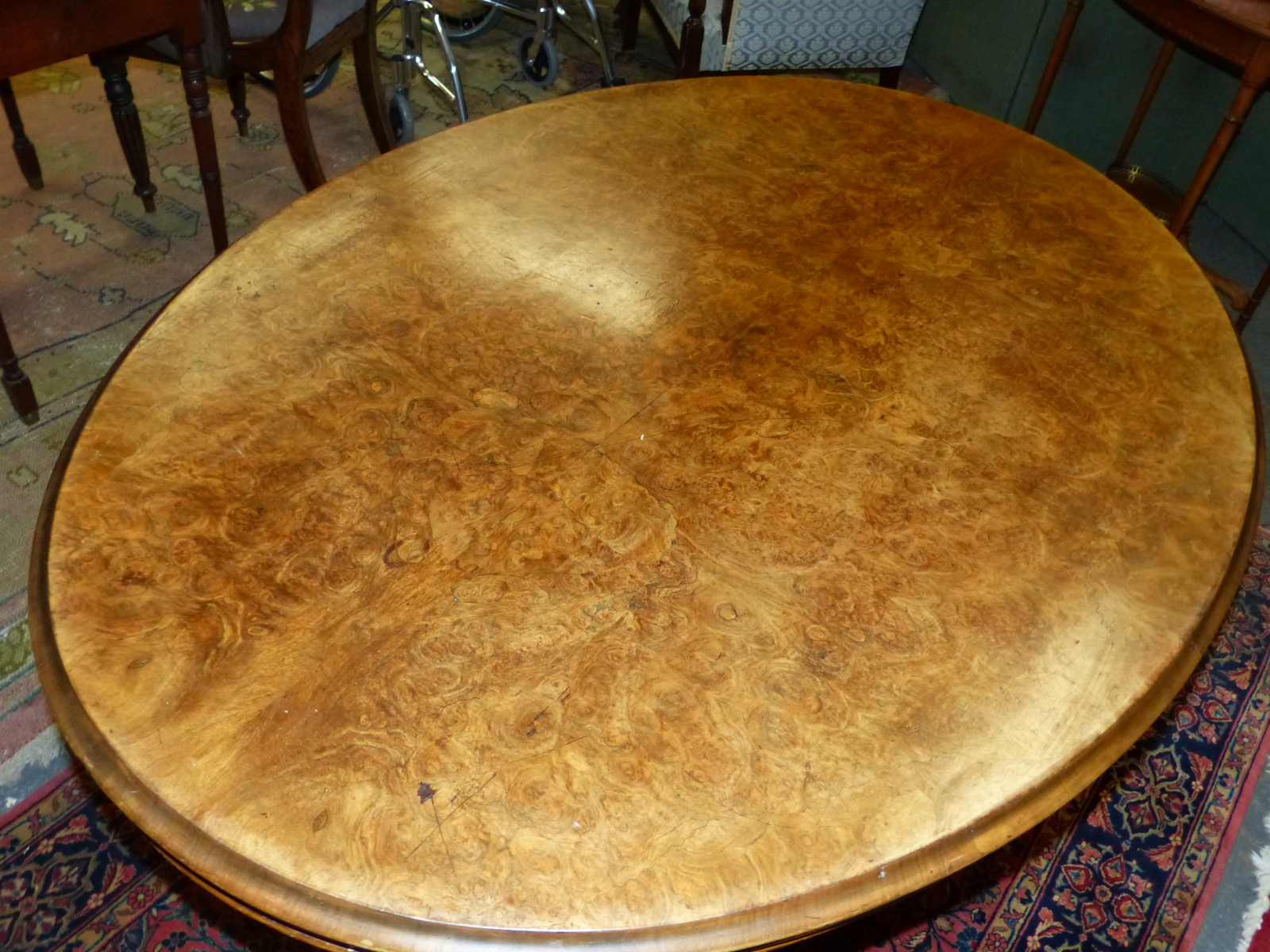 A VICTORIAN WALNUT OVAL TOP BREAKFAST TABLE ON CARVED QUADRUPED LEGS. W 101 X D 136 X H 71cms. - Image 5 of 5